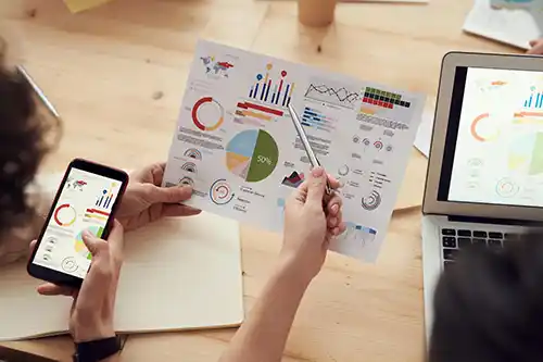 two-people-reviewing-chart